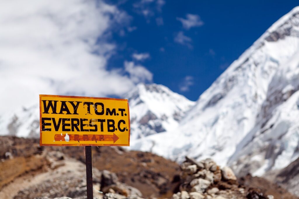 Wooden trail sign board showing directions on the Everest Base Camp trekking route