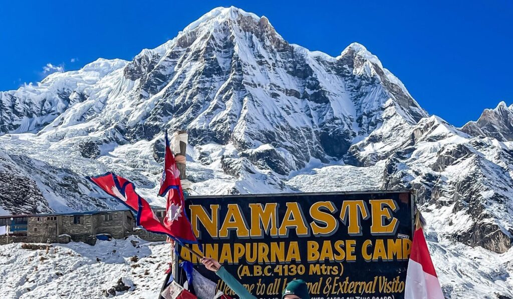 Wooden signboard showing altitude and information at Annapurna Base Camp trek.