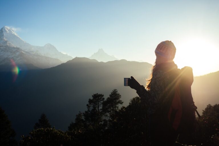 Trekkers watching sunrise from Ghorepani Poon Hill Trek with Annapurna and Dhaulagiri ranges in the background