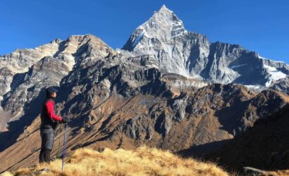 yoga trekker enjoying mountain views on Mardi Himal Trek