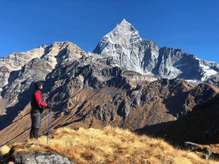 yoga trekker enjoying mountain views on Mardi Himal Trek
