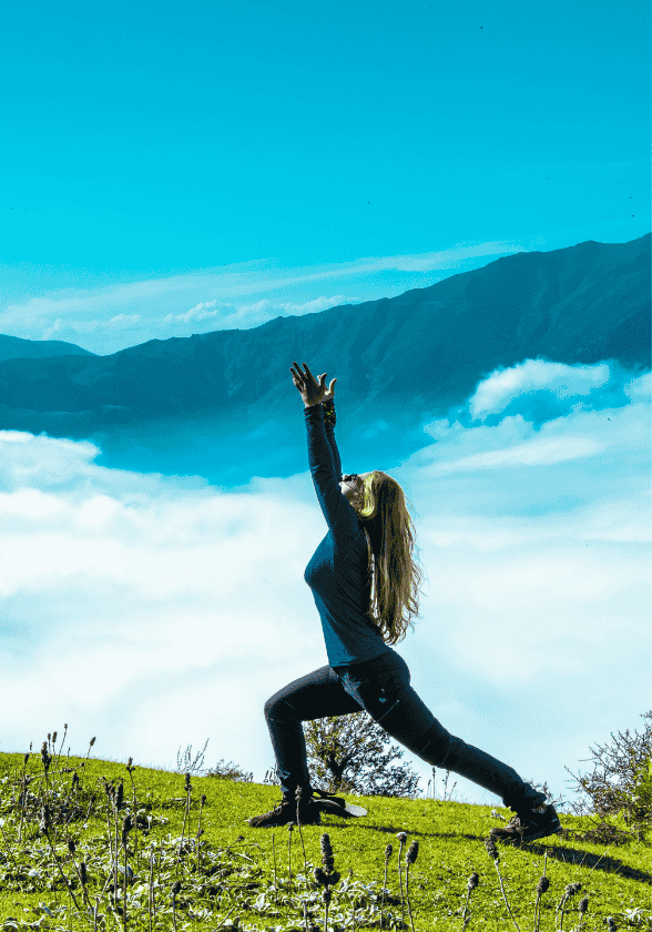 Girl Doing yoga a mountain