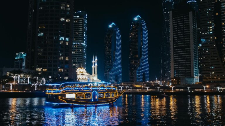 Dubai skyline illuminated as seen from a dhow cruise on Dubai Creek