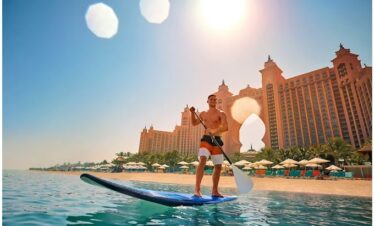 Sunset view of Atlantis Aquaventure Waterpark Dubai with illuminated rides
