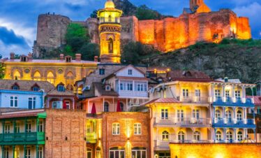 Panoramic view of Tbilisi old town with Narikala Fortress at sunset