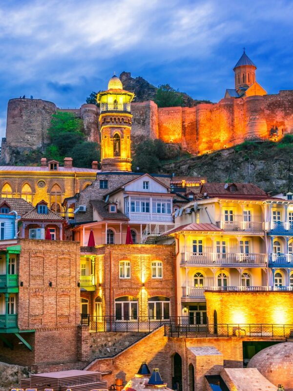 Panoramic view of Tbilisi old town with Narikala Fortress at sunset